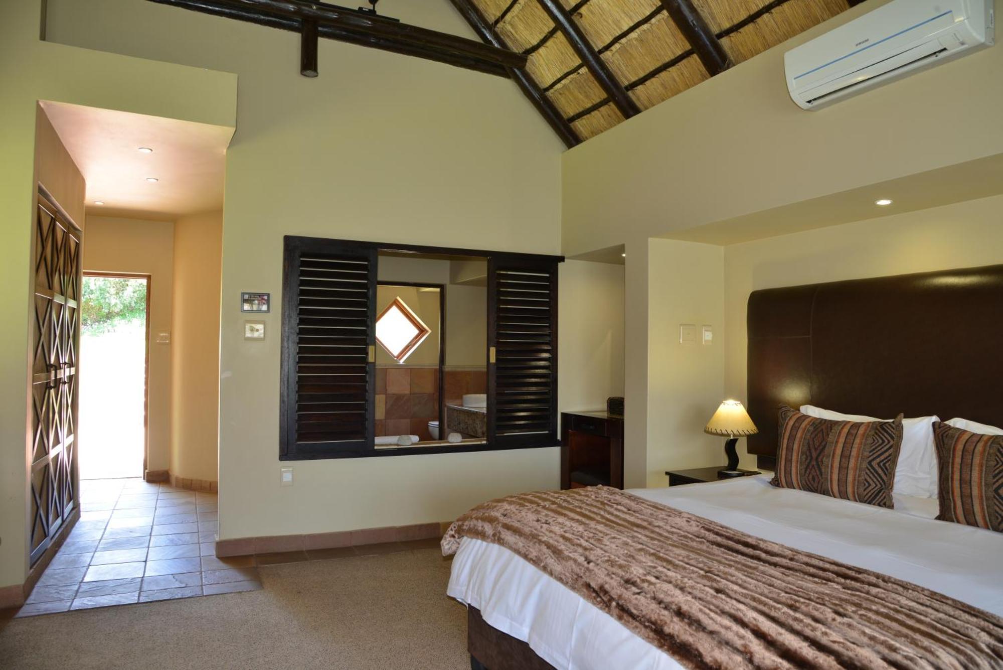 Kloofzicht Lodge & Spa Krugersdorp Pokoj fotografie A bedroom at the resort